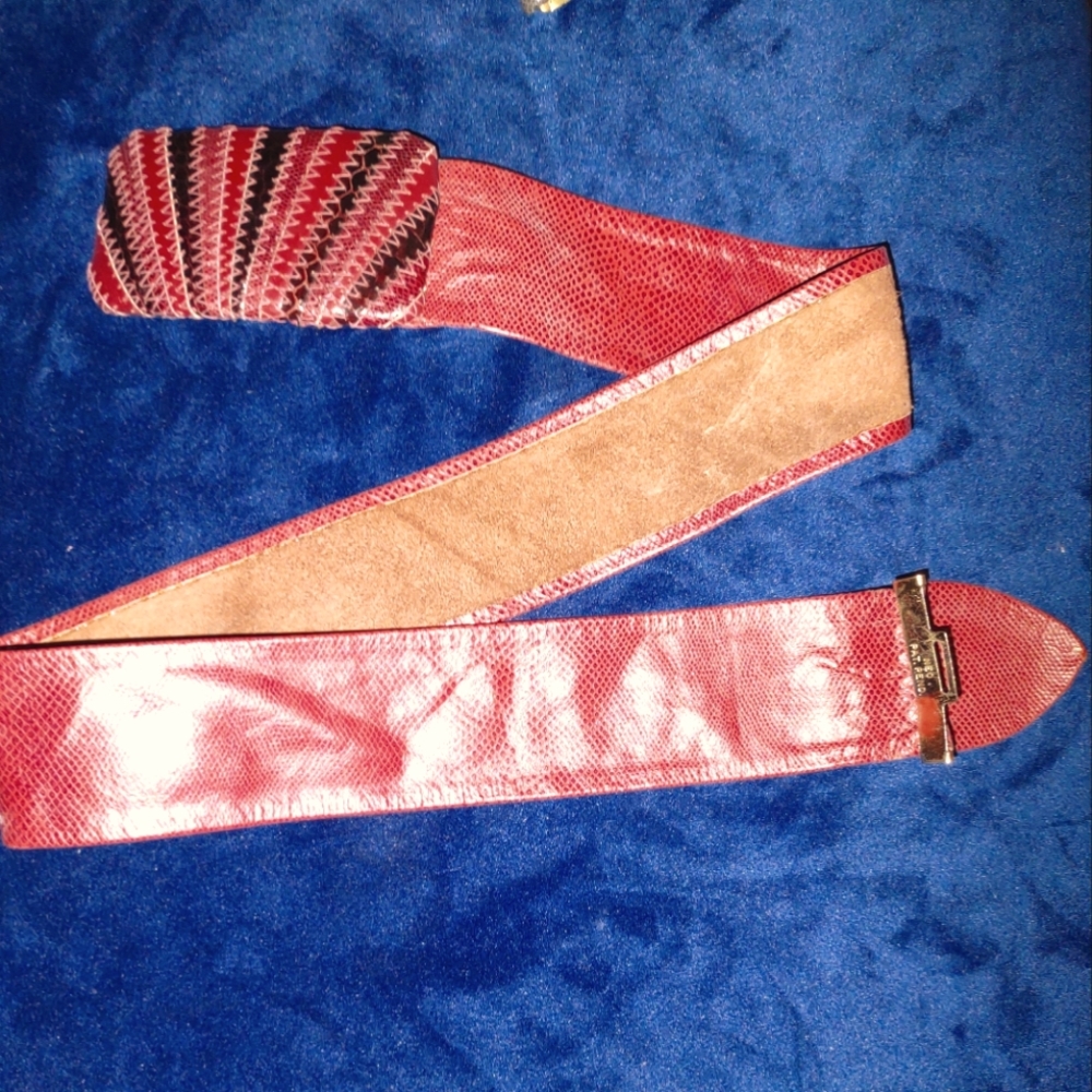 Leather belt. Brick red. Adjusts from 20"- 30" waist.